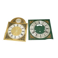 An 8-day longcase clock movement with a painted dial and various 8-day and 30-hour long case movements, dials, parts, plates, chains, and two lead weights, sold as incomplete for parts and restoration projects. 
