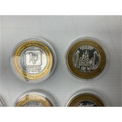 Eight Las Vegas limited edition ten dollar casino silver strike gaming tokens, consisting of a fine silver centre with brass outer ring (8)