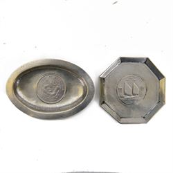 Two Chinese silver dishes both inset with coins, the first an octagonal example with a 'birds over jung' silver dollar, stamped Zee Hung Silver, the second an oval example set with a Chihli silver dollar, stamped Nanking, largest W11cm