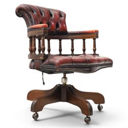 Captains swivel desk chair upholstered in oxblood leather, buttoned back and seat, shaped ...