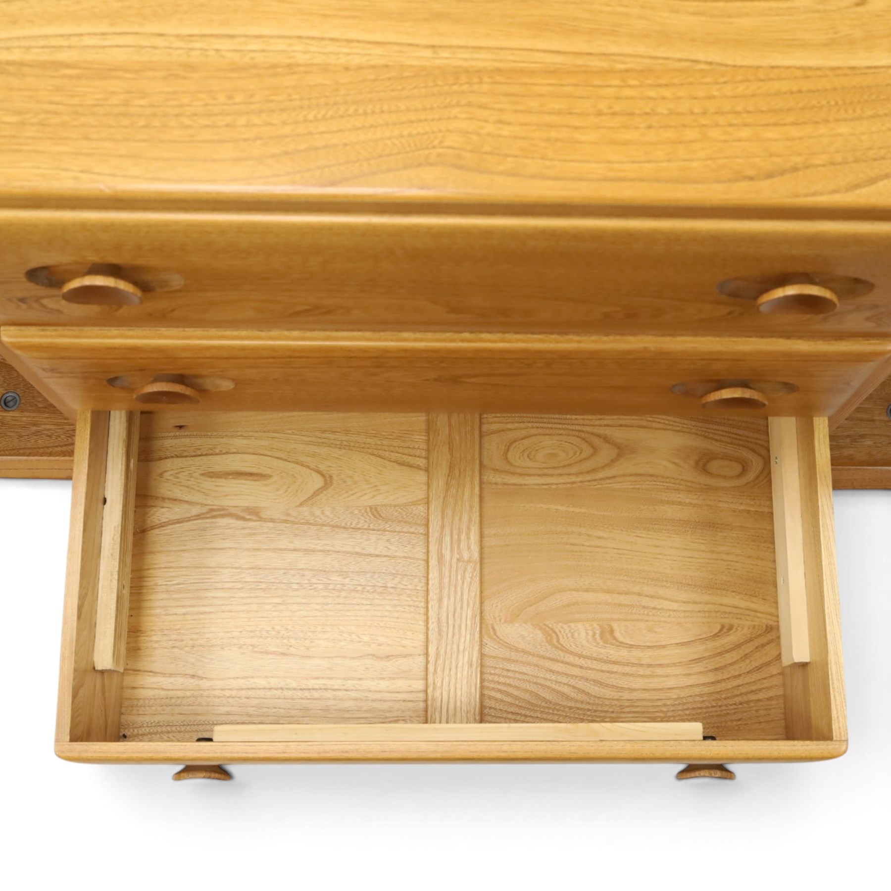 Ercol - mid-20th century light elm and beech Windsor 'model 455' sideboard, rectangular top over three central drawers flanked by cupboards, on castors