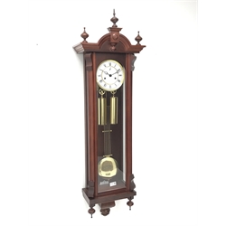  Mahogany Vienna type wall clock, arched case with turned finials, Roman dial with subsidiary seconds, Kieninger twin train movement half hour striking on a coil, two brass weights and pendulum, H123cm, W32cm  