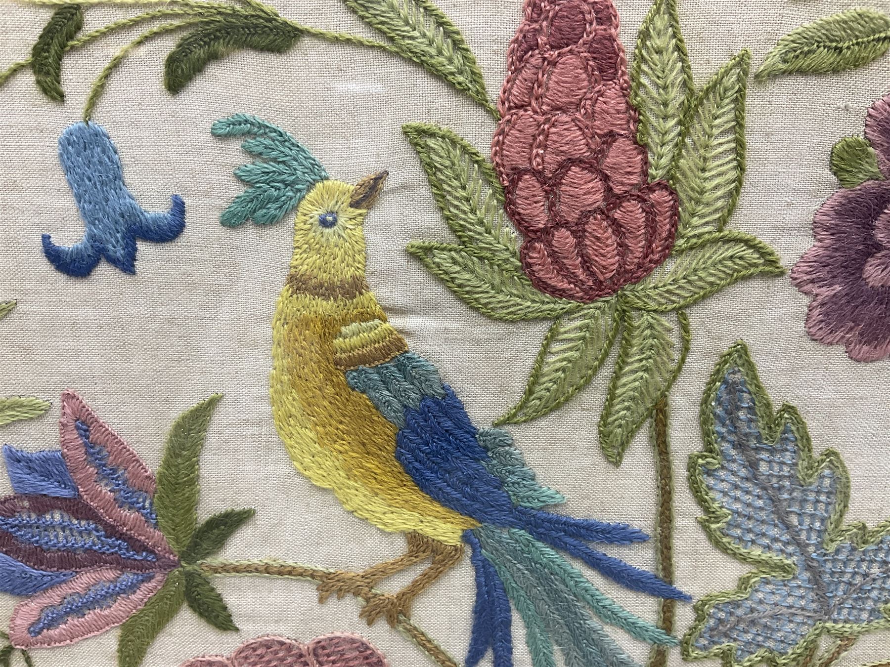 Two 1950s tapestries, the framed example celebrating the 1953 coronation, the second converted into a fire screen depicting a floral display, firescreen H70cm (2)