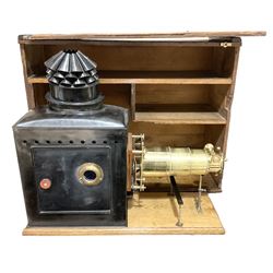 19th Century brass and tin magic lantern mounted upon a wooden base, with wooden carry case H59, L66cm