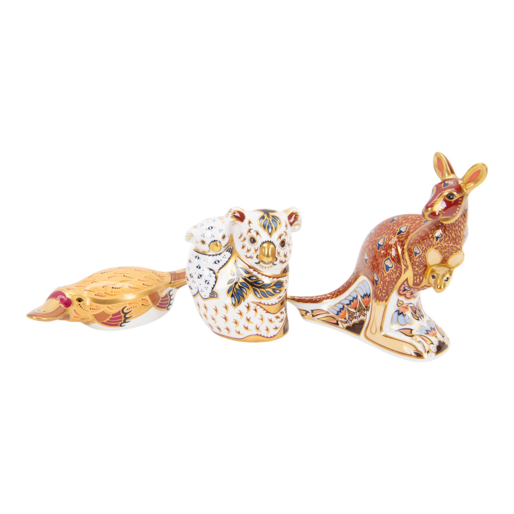 Set of three Royal Crown Derby paperweights, The Australian Collection, Kangaroo and Joey, Duck-billed Platypus, and Koala and Baby, part of a gold signature edition with limited availability until the end of 2000, each with gold stoppers, Kangaroo and Joey H15cm