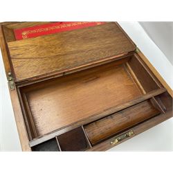 19th century burr yew wood tea caddy, of sarcophagus form, with strung details and brass mounts, the interior split into three compartments, upon four brass bun feet, together with an oak and brass bound writing slope, with red leather interior with gilt detailing, largest H16cm, W40cm