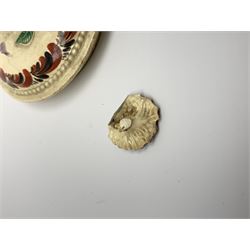 18th century creamware teapot, probably Leeds, with reeded entwined handle and floral finial to the cover, the body with hand painted polychrome decoration of figure to one side, and floral spray to the other, collectors paper label beneath inscribed Leeds Pottery, H11.5cm