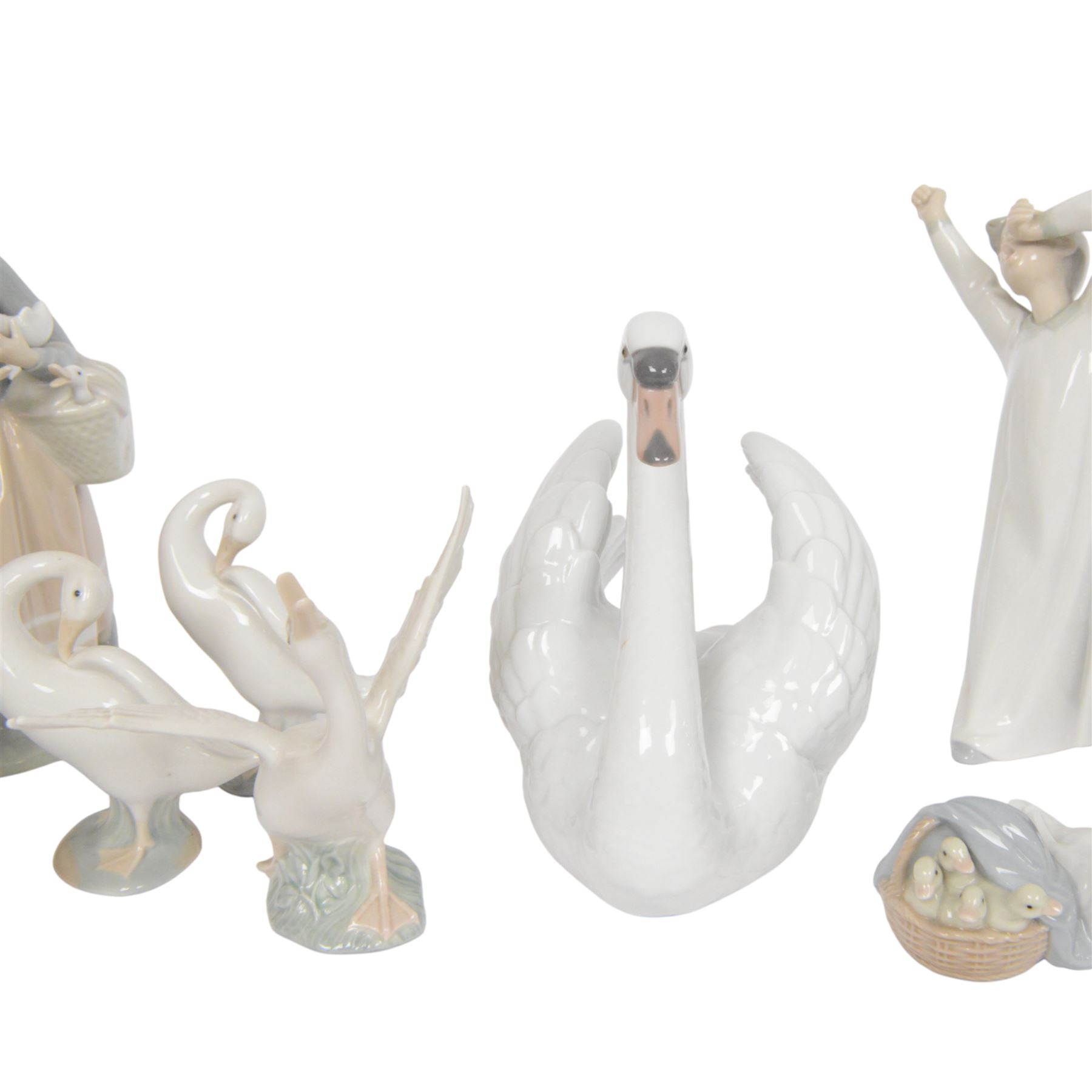 Ten Lladro figures, including Swan 5231, Friendship 1230, Geisha Girl 4989, Boy with Yacht etc 