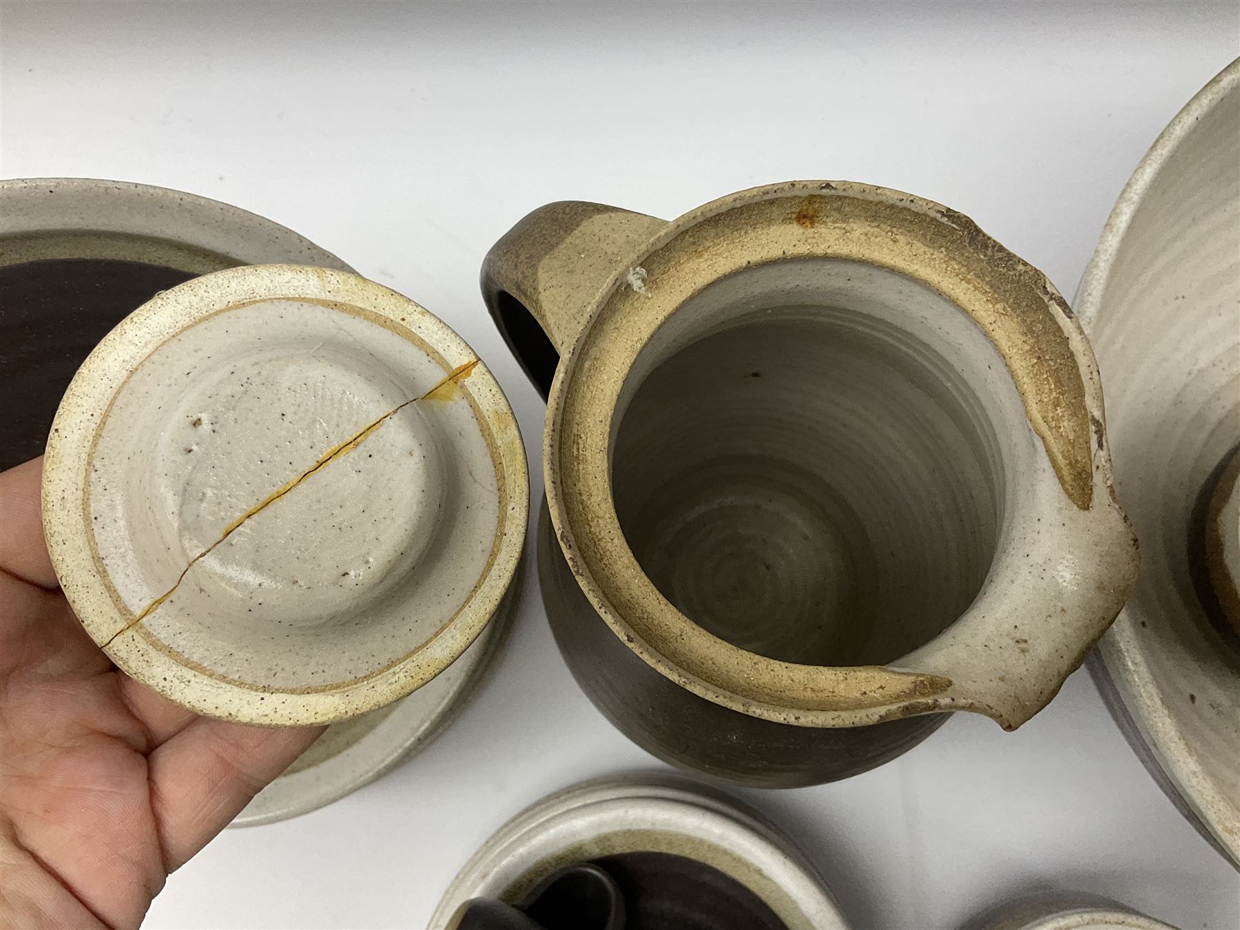 Marianne De Trey (British 1913-2016) stoneware coffee service for twelve, together with a large deep stoneware footed bowl and ladle with wood handle, all decorated in Manganese 'Pattern 1' with impressed shell marks, bowl D27cm