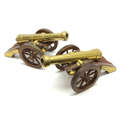 Large pair of 20th century brass model cannons, each on brass mounted mahogany carriage with coopered spoked wheels L39cm