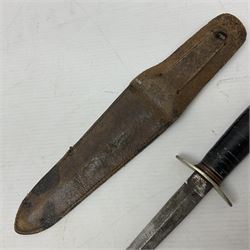  British Private Purchase fighting knife by William Rodgers, Sheffield, the 15cm double edge steel blade with raised medial ridge, stamped on one side of the ricasso WILLIAM RODGERS I CUT MY WAY, the opposing side marked MADE IN SHEFFIELD, ENGLAND, with aluminium crossguard and pommel, stacked leather washers grip and leather scabbard L27.5cm overall; and a crudely made short sword with 32.5cm single edged blade and steel knucklebow hilt with hardwood grip; in cane bound wooden scabbard L45cm overall (2)