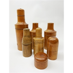  A collection of six Victorian treen bottle holders, largest H27cm, together with a treen box of circular form with screw threaded cover,  D6.5cm.   