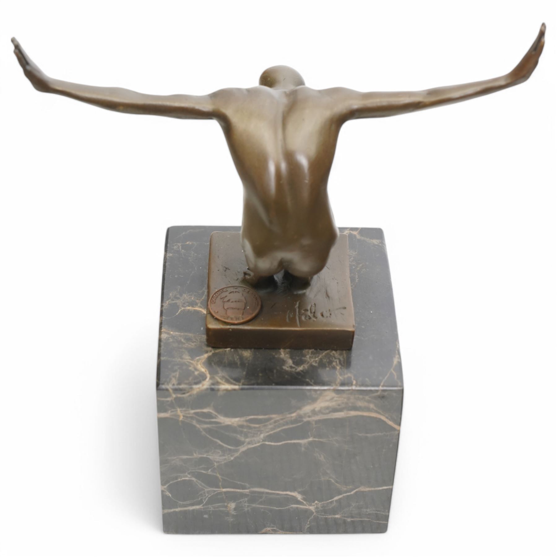 Bronze figure after Milo, a 'Power Of Silence', modelled as a male athlete crouched with arms outstretched upon a marble plinth, signed Milo, H15cm