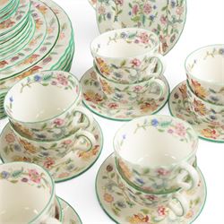 Minton Haddon Hall tea and dinner service, including teapot, milk jug, hot water jug, open sucrier, ten teacups and eight saucers, eight dinner plates, eight soup bowls, etc 