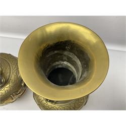 Pair of Chinese brass vases, of ovoid form with elongated neck and fluted rim, decorated in high relief with a dragon chasing a flaming pearl around the neck, the body with dragons, birds and buildings, with character marks beneath, H25cm