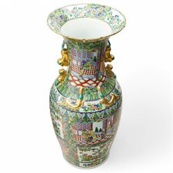 Pair of large 20th century Chinese famille rose floor vases, each of baluster form with waisted neck with gilt foo dog mounted shoulders, and lobed flared rim, decorated with alternating reserves of figures and birds and butterflies amidst blossoming flowers, the white ground profusely detailed with flower heads, each with character mark beneath, H87cm 