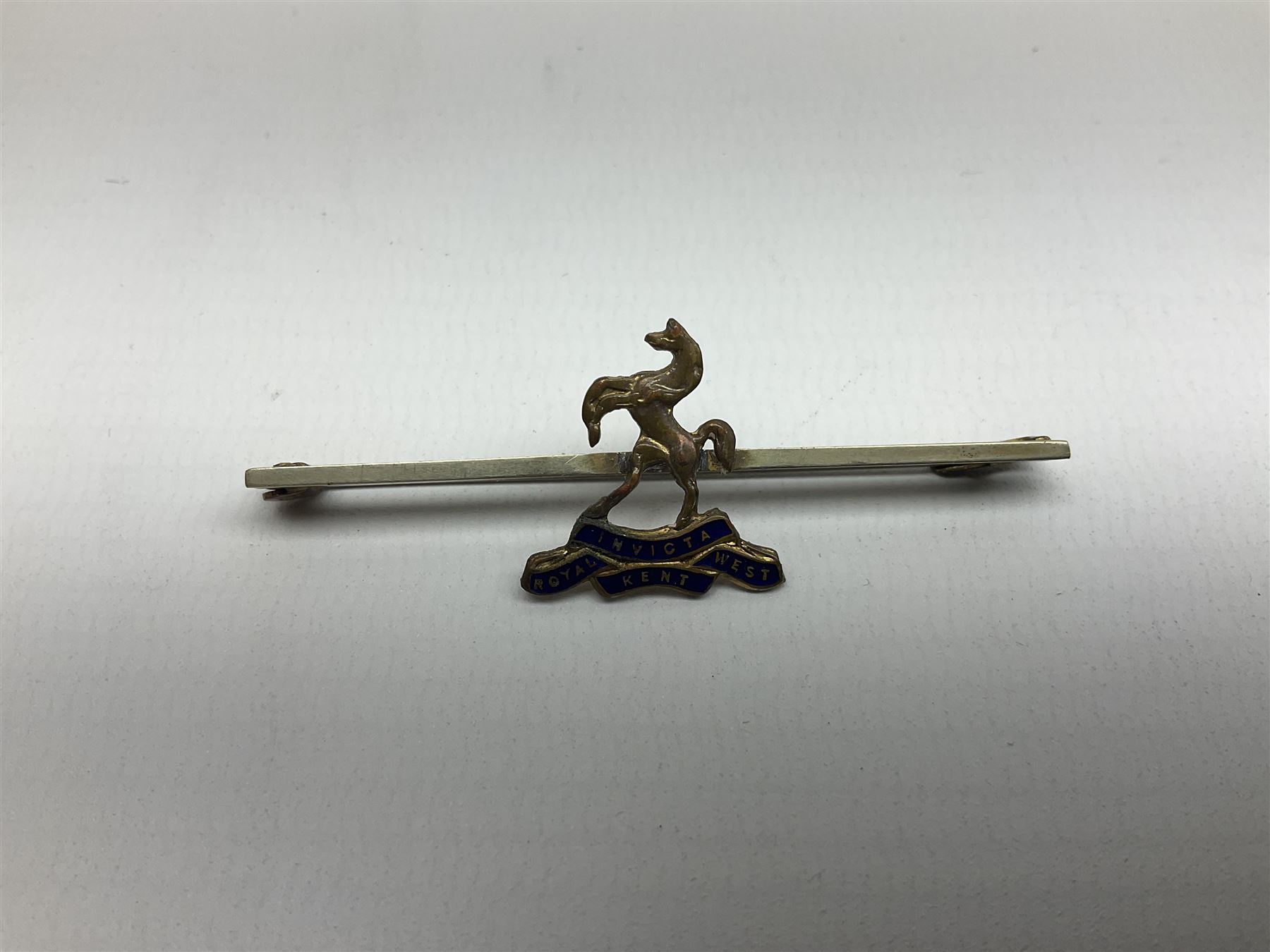 Royal West Kent regiment 9ct gold and enamel sweetheart brooch; The Queens Own regiment silver and enamel sweetheart brooch; and another sweetheart brooch for the Royal West Kent regiment (3)