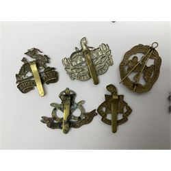 Seventeen regimental cap badges including Dorsetshire, Worcestershire, Staffordshire, Lancashire, Manchester, Middlesex, Berkshire, Bedfordshire etc (17)
