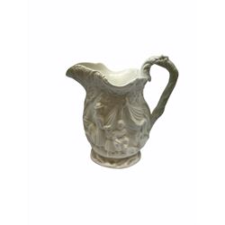 Victorian Parian ware twin handled vase detailed with Bacus masks fruiting vines and floral sprays H36cm, together with a Parian jug H14.5cm, classical Parian sculpture H40cm, decorative plaque decorated in high relief depicting two children D18.5cm. 