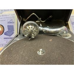 HMV portable wind up gramophone in a black case, together with a collection of records. 