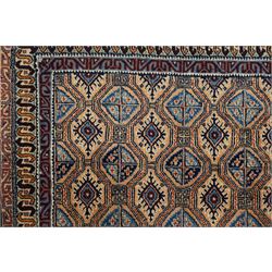 North East Persian Moud hand-knotted carpet, ivory field with an-over Herati inspired lattice of repeating lozenge and diamond motifs, with stylized floral devices and angular vinery in tones of sky blue, indigo, madder red and camel, principal border with a sequence of stylized palmettes and angular vine motifs, framed by narrow guard stripes, with cotton fringe ends