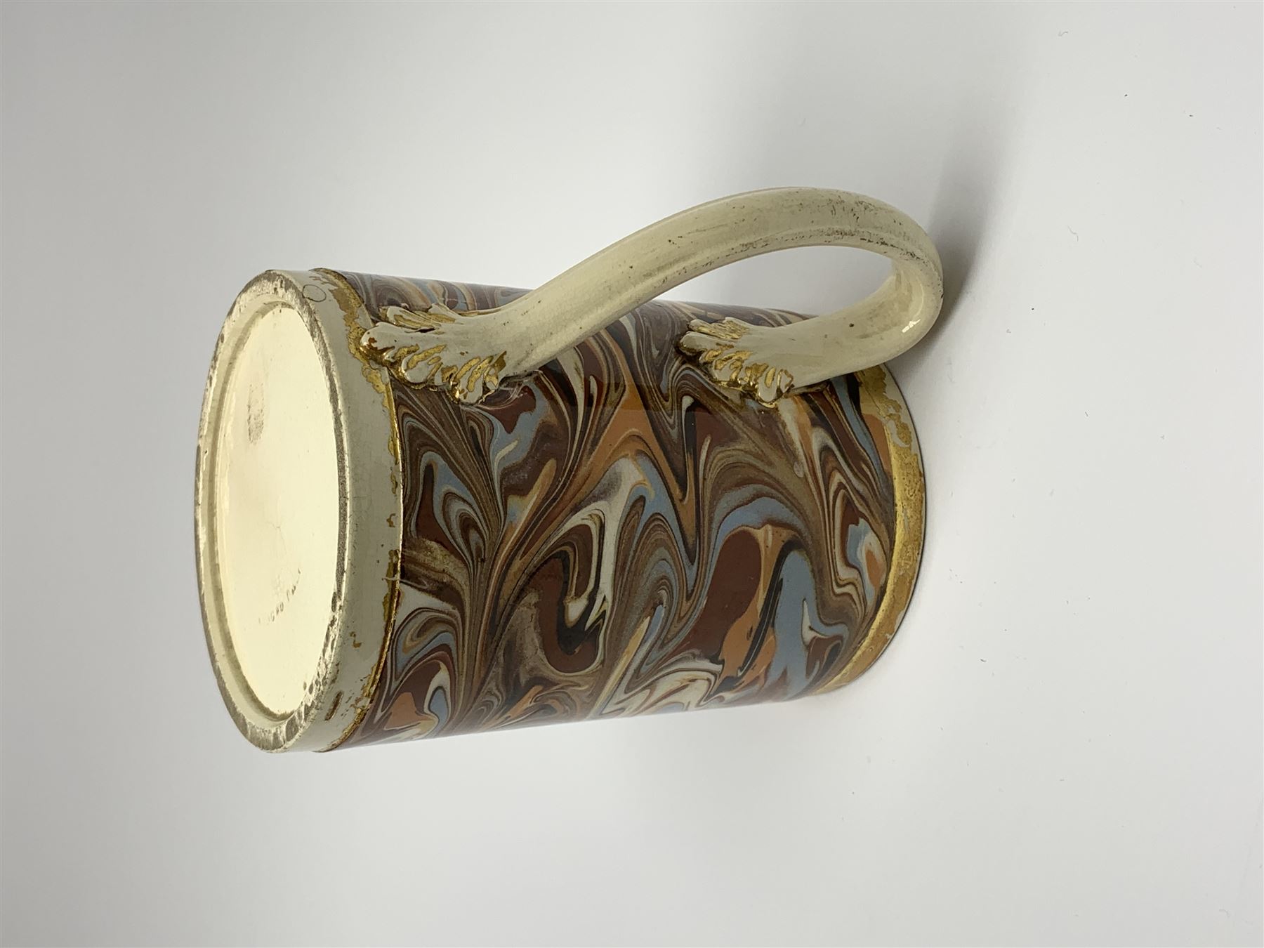 Late 18th century earthenware mug, possibly Ralph Wedgwood, Burslem or Ferrybridge, with surface marbled decoration and later gilt detail to rims and handle, impressed beneath Wedgwood & Co, H12cm
