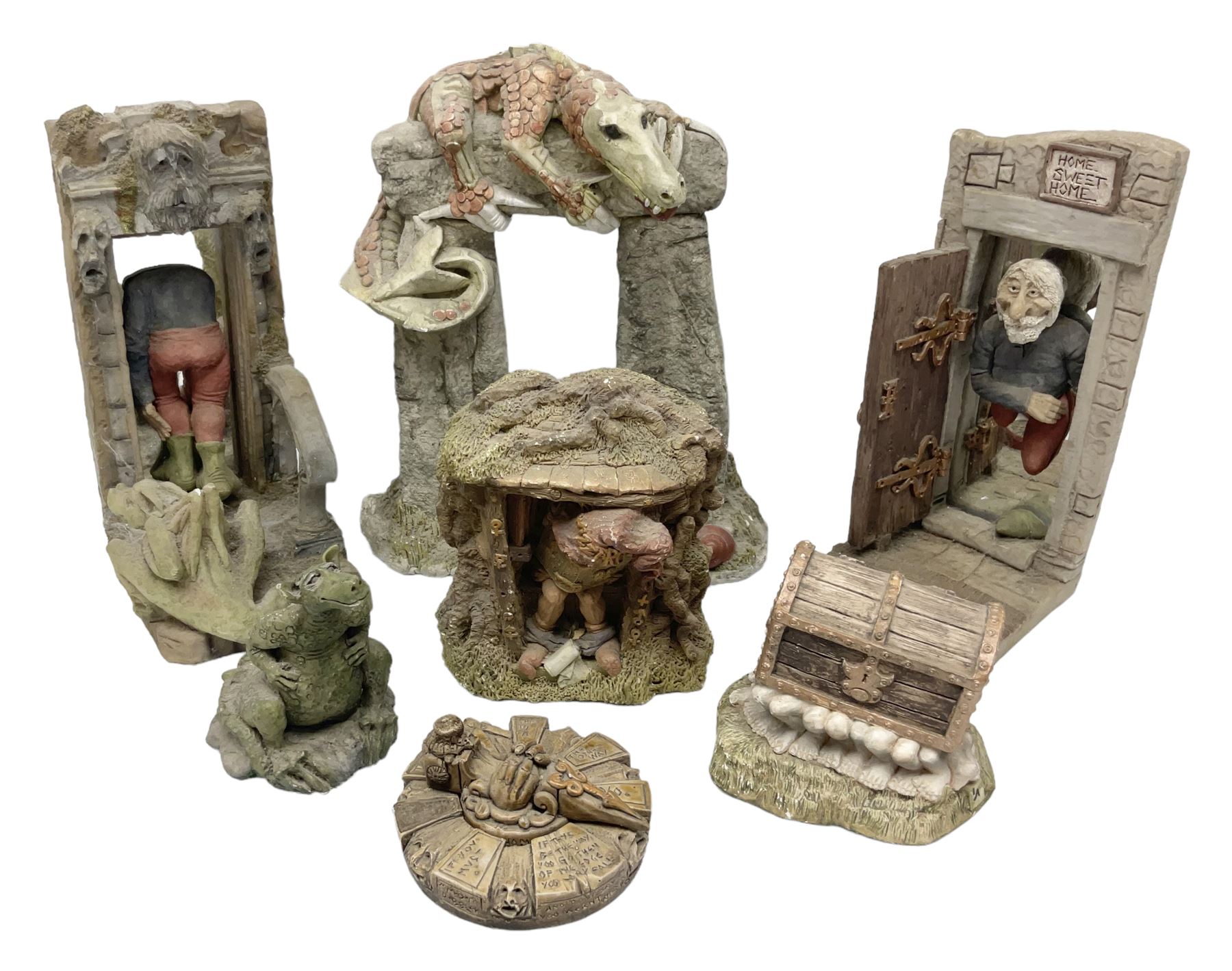 Seven Terry Pratchett Discworld figures by Clarecraft, to include The Luggage DW04M Smugli D990, pair of Home Sweet Home bookends, wall hanging modelled as a dragon upon stone plinth etc, tallest H19cm