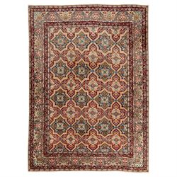 Central Persian Kirman carpet, the field arranged with alternating indigo star shaped and ...