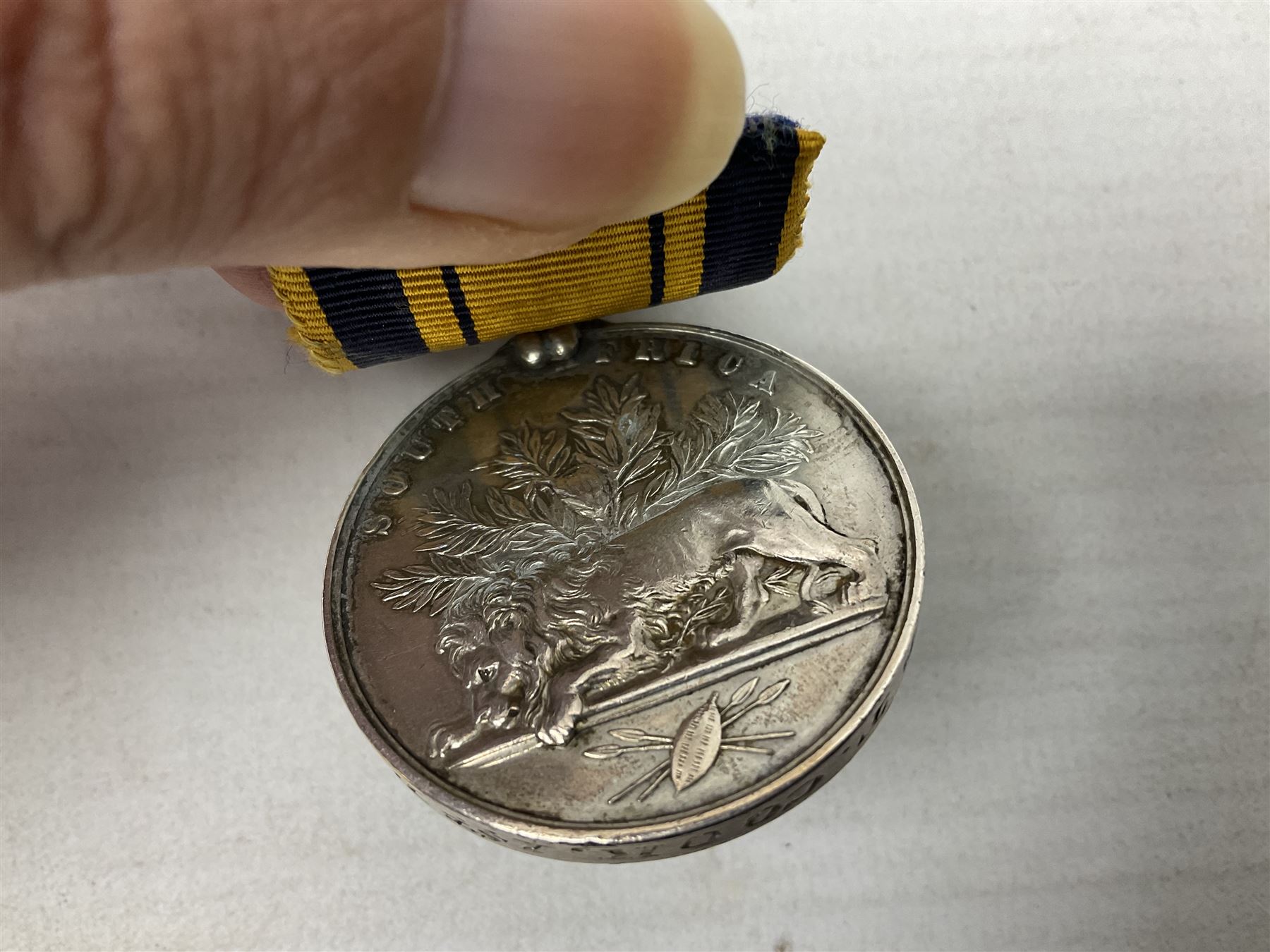 Victoria South Africa (Zulu) Medal with clasp for 1879, awarded to 2112 Pte. T. Cook 1st Dgn. Gds. with card stiffened ribbon