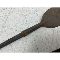 Native long-shafted spear, the large iron head with central medial ridge and decorative neck, on plain circular haft L260cm; and another similar Native long-shafted spear with cane haft L249cm (2)