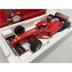 Four Paul's Model Art 1:18 scale Michael Schumacher Collection die-cast racing cars - Ferrari F310B; Ferrari F310/2; Benneton Renault B195; and Ferrari F300; all boxed (4)