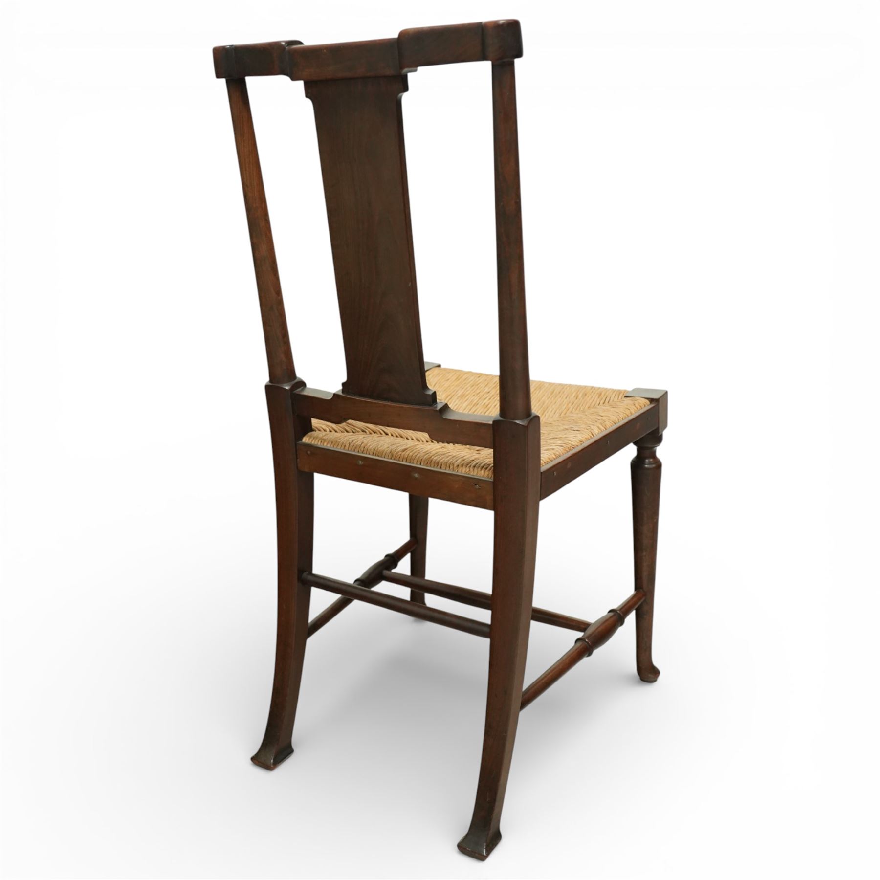 Pair of Morris & Co ‘Hampton’ design chair attributed to H. Howes, the shaped rectangular back with central splat over a rushed seat, on turned supports united by stretchers