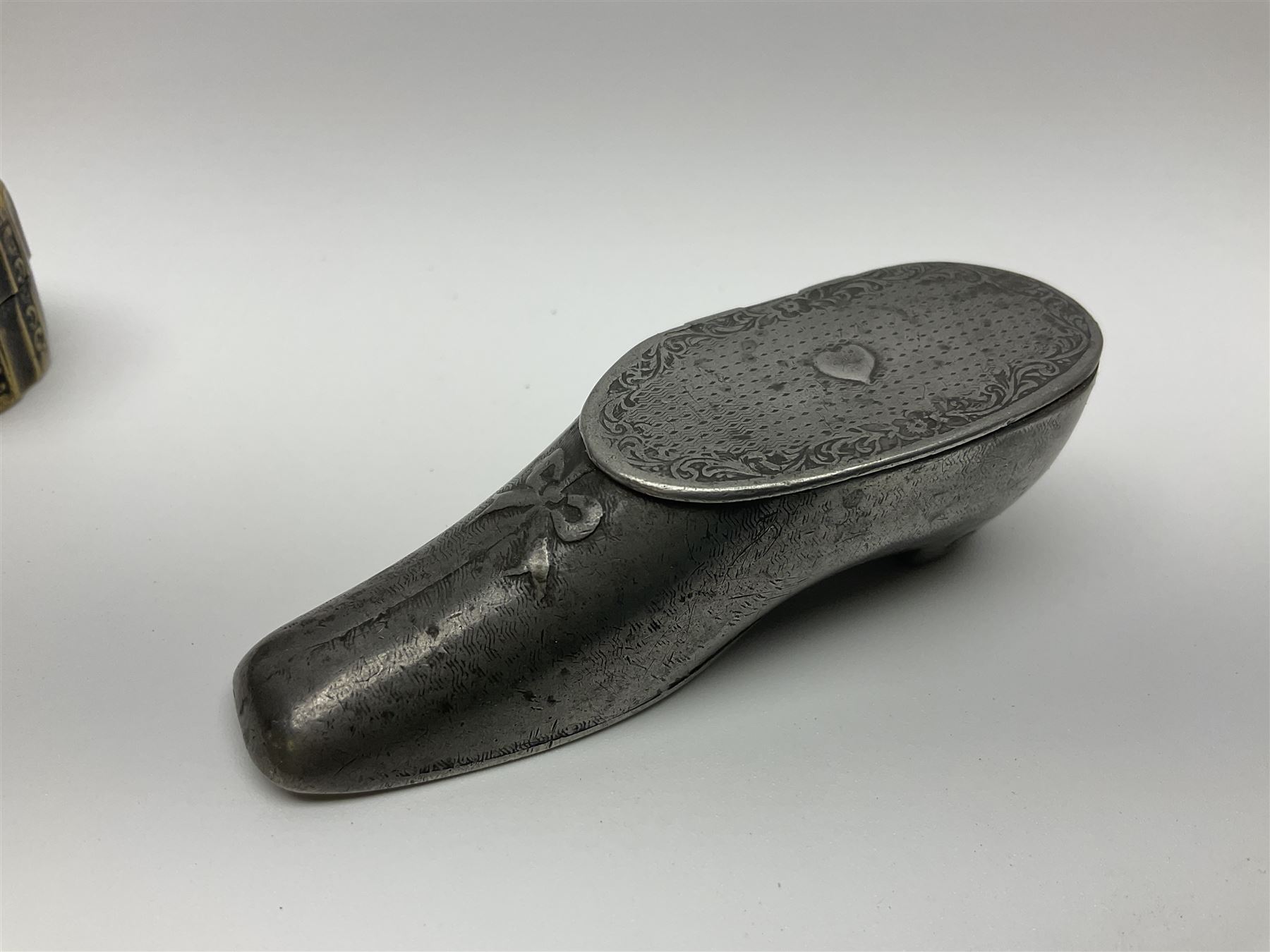 Five snuff boxes, including novelty snuff box in the form of a shoe, pierced example, rectangular hinged lid with white metal decoration and two others  