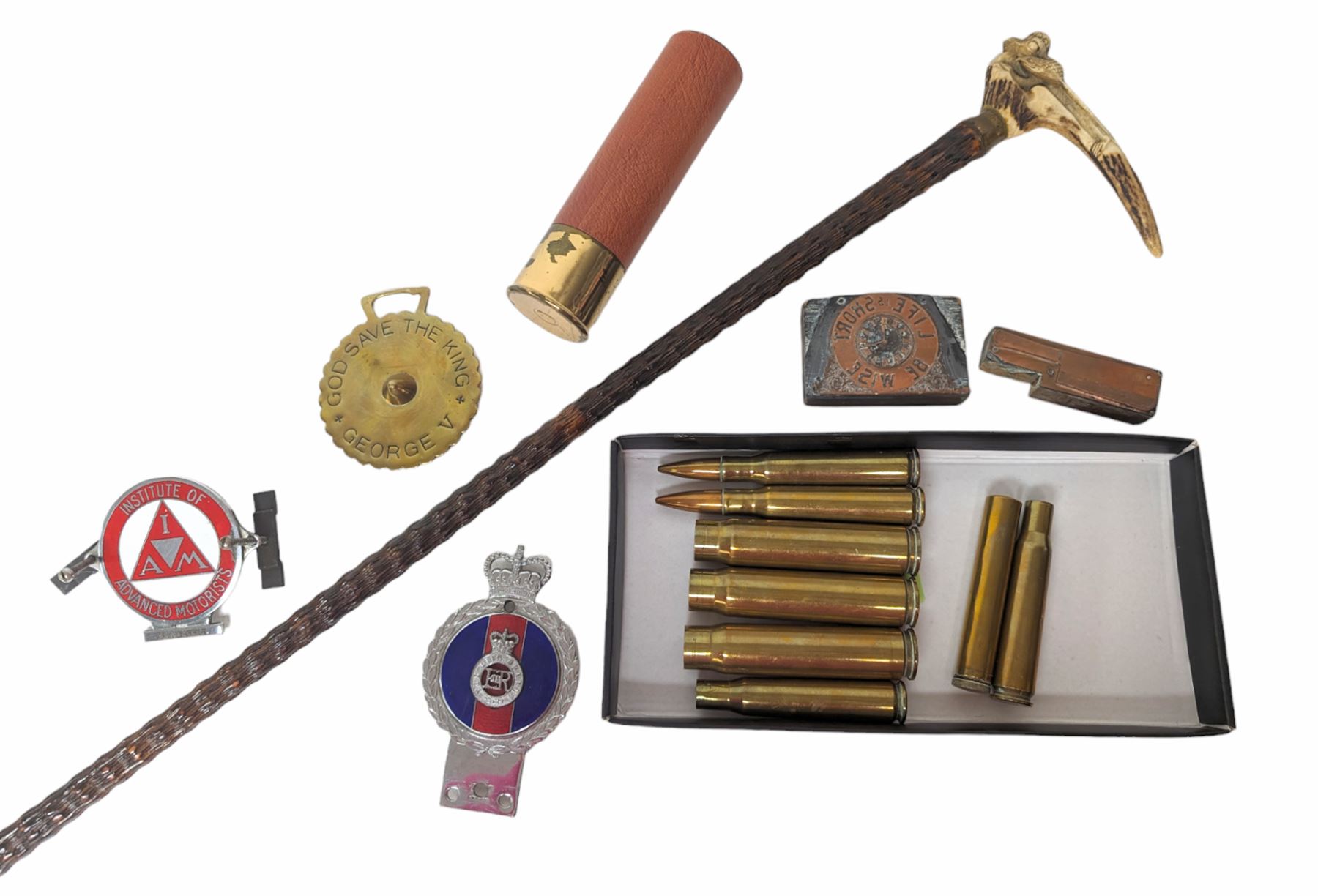 Walking stick with carved monkey handle, glass shooting flask in the form of a cartridge, bullet casings and other collectables