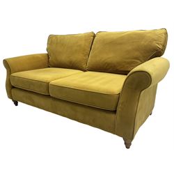 Next Furniture - traditional shaped three-seat sofa, upholstered in mustard velvet, rolled arms with pipping, on turned front feet