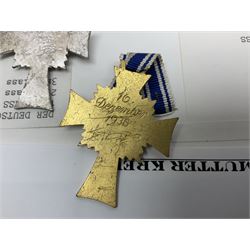 WWII set of three German Mother's Crosses, 1st Class in gilt, 2nd Class in silver and 3rd Class in bronze; all with ribbons (3)