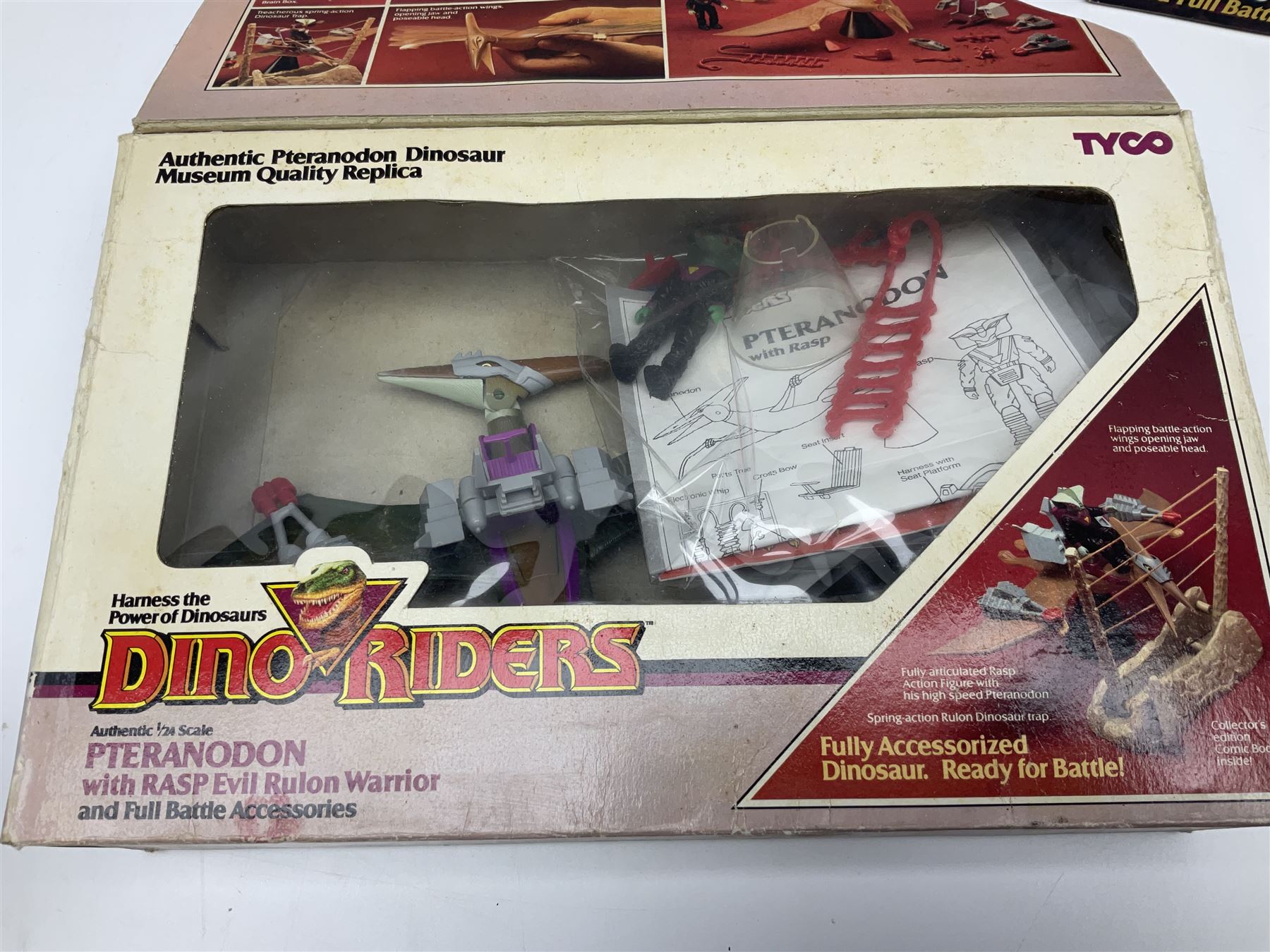 Three Tyco Dino-Riders by Action GT playsets - Pteranodon with Rasp Evil Rulon Warrior; Monoclonius with Mako Evil Rulon Warrior; and Placerias with Skate Evil Rulon Warrior; all boxed (3)