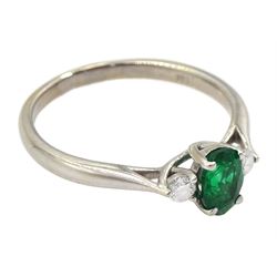 18ct white gold three stone oval emerald and round brilliant cut diamond ring, London 2016, emerald approx 0.30 carat