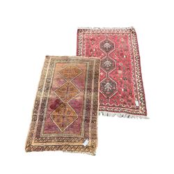 Small Persian rug, decorated with three stepped lozenge medallions (140cm x 91cm), and another Persian red ground rug (147cm x 104cm)