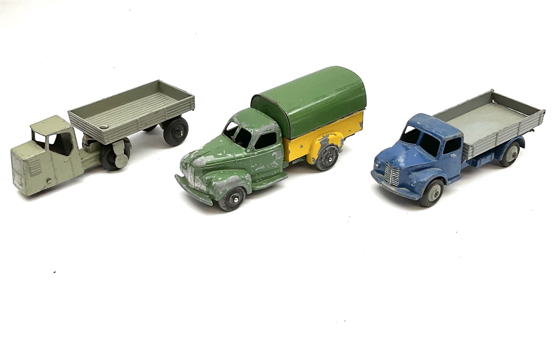 Dinky - six unboxed and playworn early die-cast commercial vehicles including French made Studebaker M16 covered wagon, Trojan Oxo van, B.E.V. Truck, Dodge Tipper, Royal Mail Van etc (6)