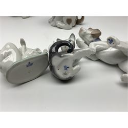 Five Lladro figures, comprising Cat and Mouse no. 5236, That Tickles no. 5888, Gentle Surprise no. 6210, Little Hunter no. 6212 and Resting Polar Bear no. 1208, largest H12cm