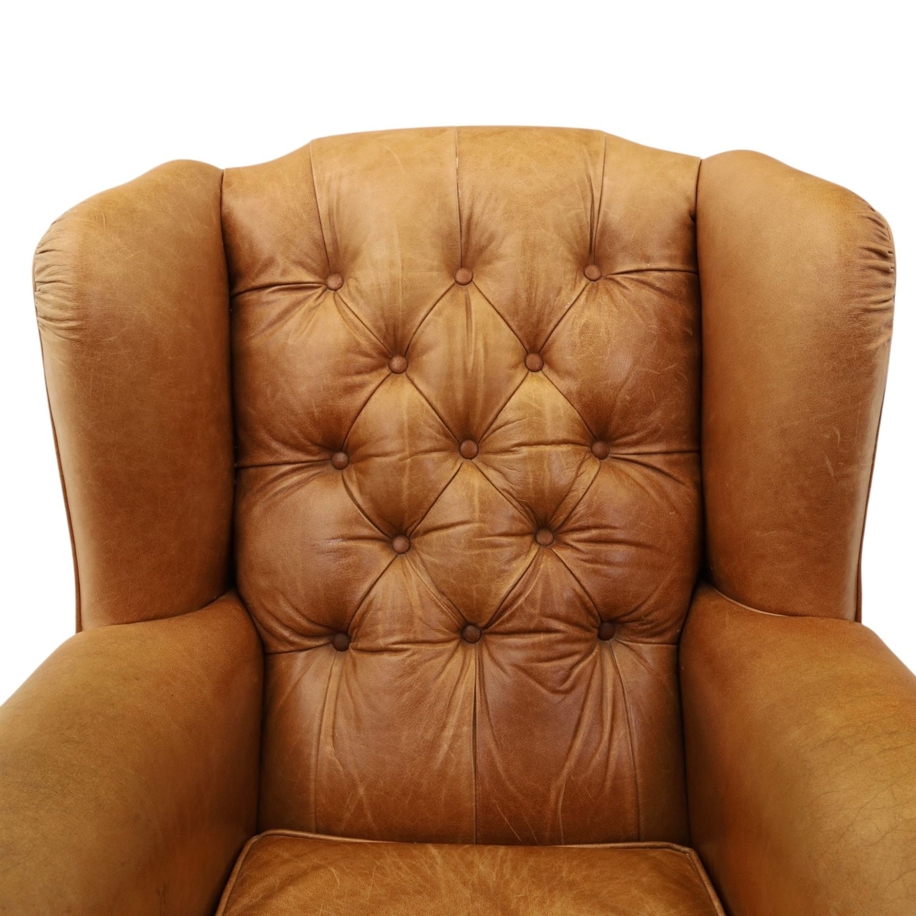 TETRAD for John Lewis - brown leather upholstered wingback armchair, button back with diamond tufted detail, loose seat cushion with piped edge, scroll arms and padded side wings, on short supports