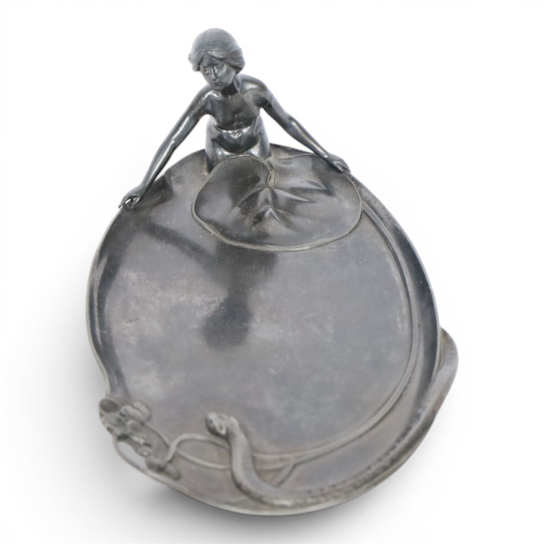 WMF Art Nouveau pewter tray, of oval from, with a female figure covered with a lily pad at one end, and snake with flowers and whiplash stems at other, signed and impressed marks beneath, H8cm, L25cm 