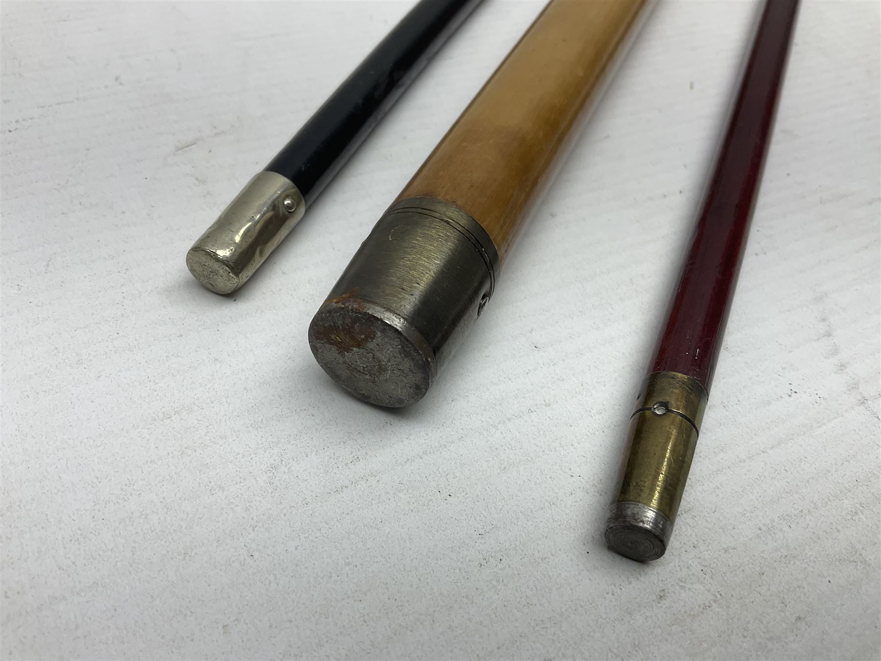 Three parade ground canes - malacca cane Coldstream Guards with plated mount engraved 'H.A. Myhan' L87cm; ebonised Church Lads Brigade 'Fight The Good Fight'; and mahogany stained Worcestershire Regiment (3)