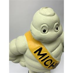 A cast iron Michelin man type figure, H40cm.