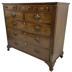 Early 19th century mahogany chest, three shallow frieze drawers over two short and three long cock-beaded drawers, canted corners with reeded moulded square columns, on ogee bracket feet
