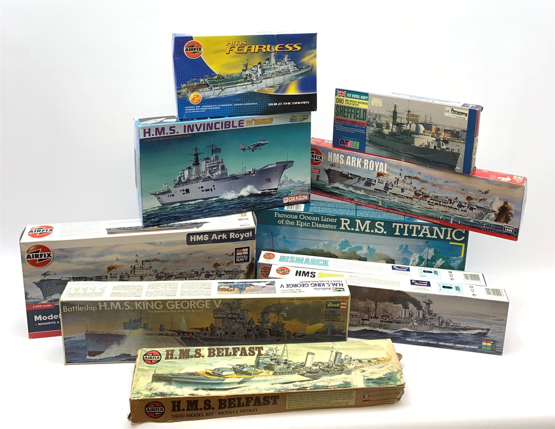 Ten plastic model kits of ships by Airfix, Revell, Dragon and Skywave, predominantly 1/600th scale including R.M.S. Titanic, HMS Invincible, two x HMS Ark Royal, HMS Fearless, HMS Hood, HMS Belfast, Bismarck etc; all boxed, most in factory sealed transparent packaging (10)