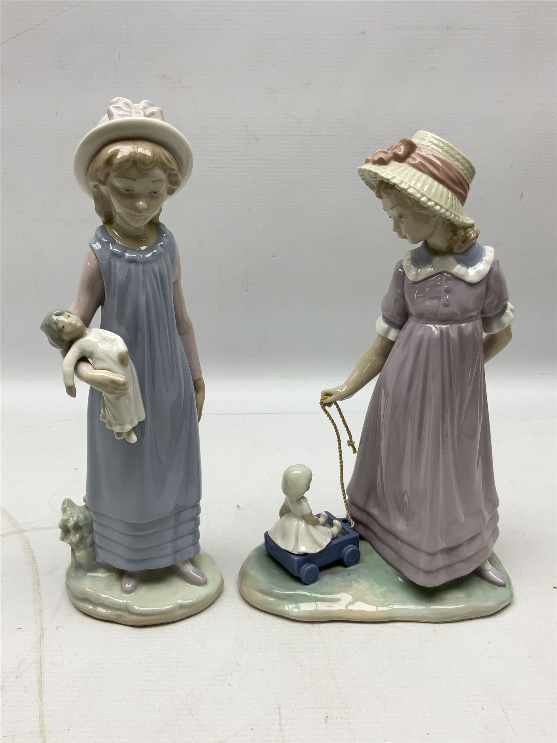 Four Lladro figures, comprising Pulling Dolls Carriage no 5044, Belinda with her Doll no 5045, Pretty Pickings no 5222 and Shepherdess with basket no 4678 