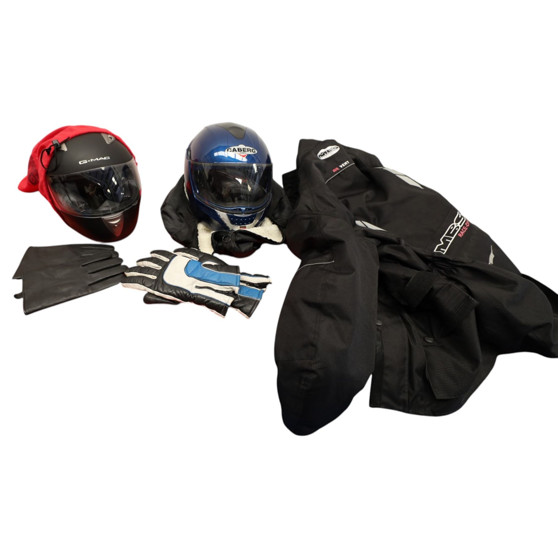 Collection of motorcycle clothing including MCS jacket, two pairs of gloves and two helmets 