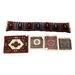 Long flatweave Kilim textile cushion, in crimson and decorated with geometric motifs and c...